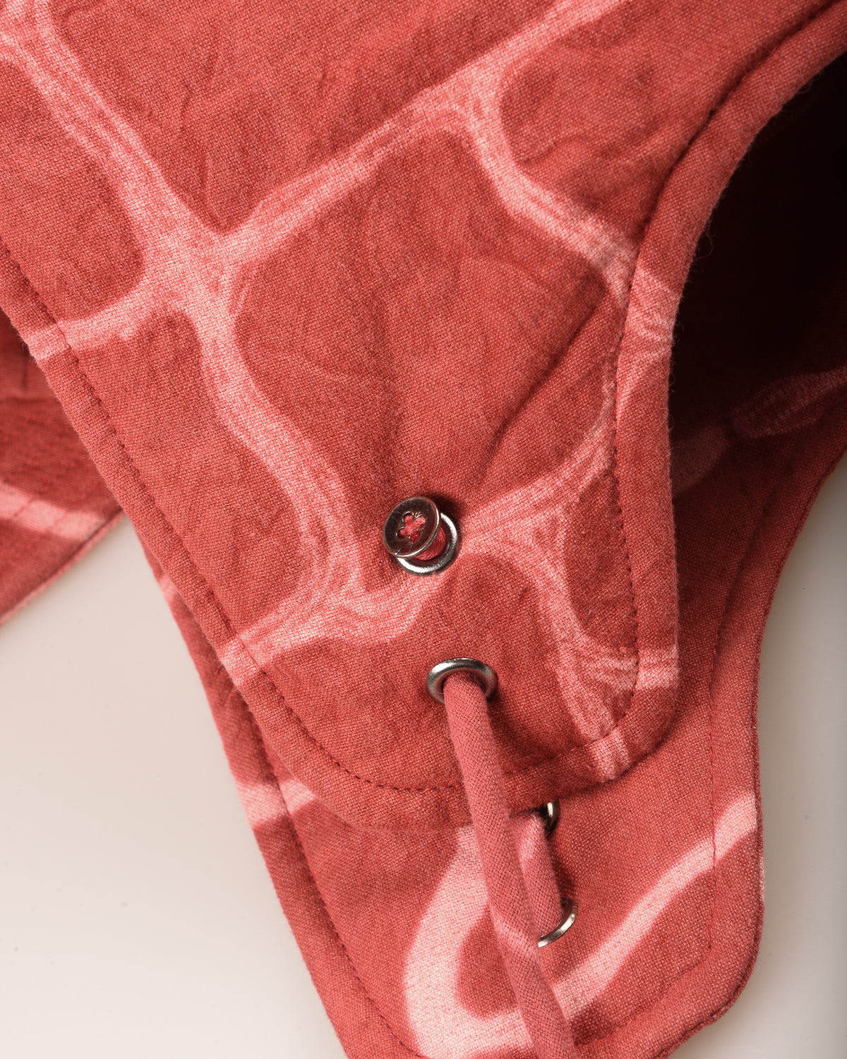 KARDO QUILTED SHIBORI FLAP CAP - LIVING CORAL
