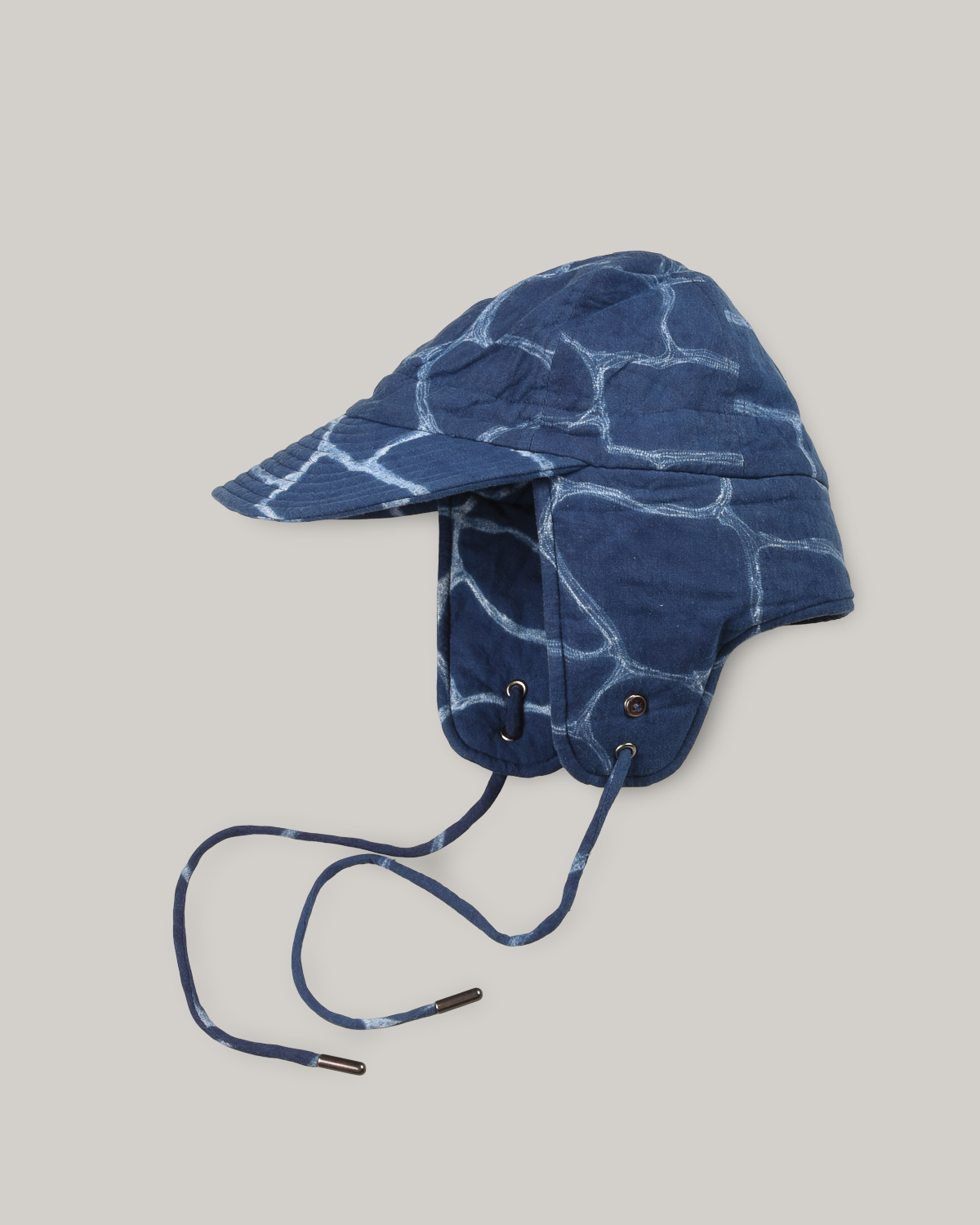 KARDO QUILTED SHIBORI FLAP CAP - INDIGO